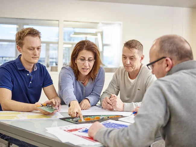 Cicor engineering team discussing a project