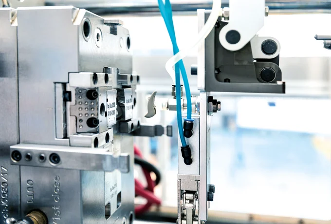 Plastic injection molding of a hearing aid component at the Cicor site in Batam