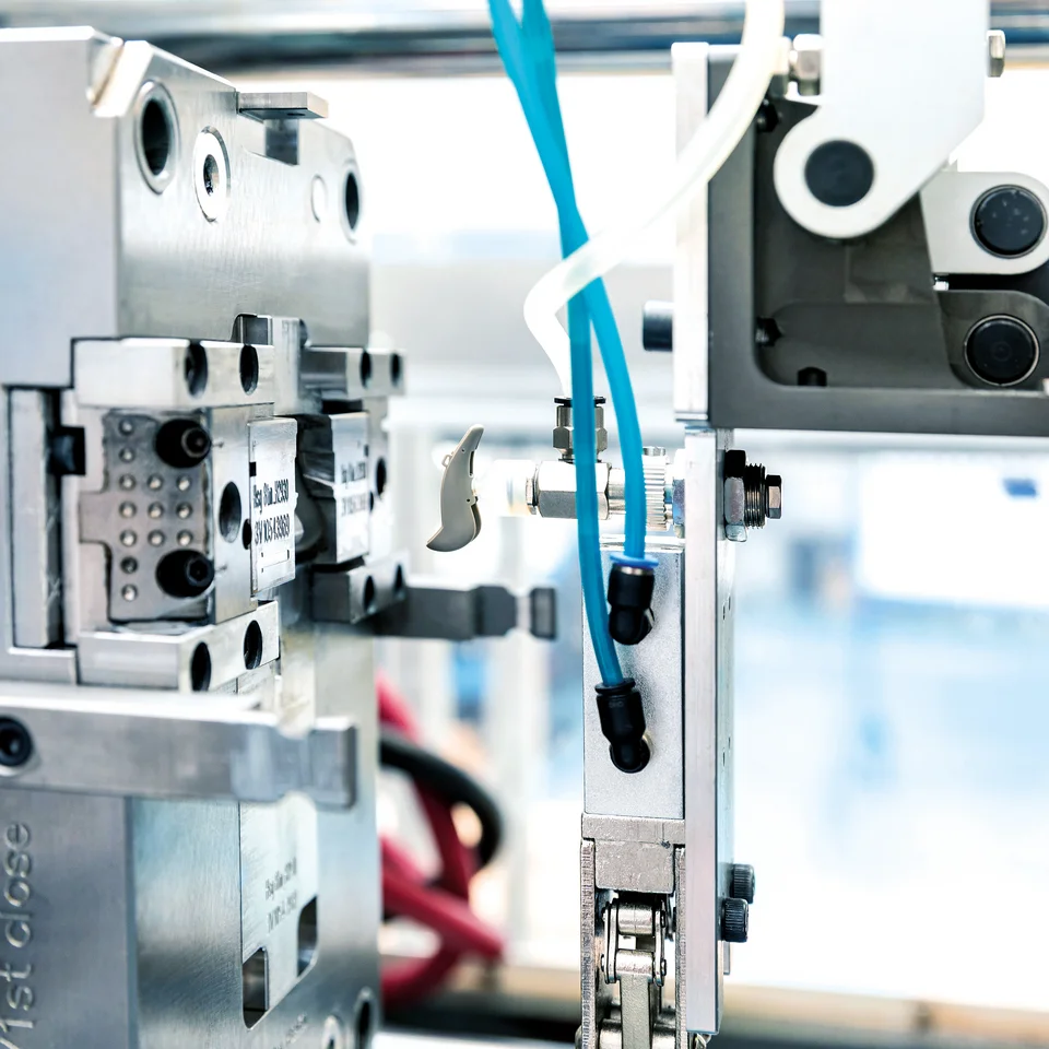 Plastic injection molding of a hearing aid component at the Cicor site in Batam