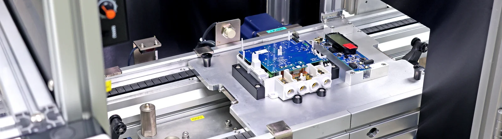 Electronic meter assemblies undergoing automated testing on a production line at Cicor in Senai, Malaysia.