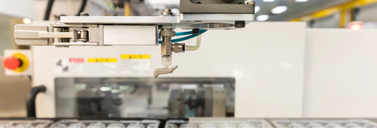 Plastic injection molding of a hearing aid component at the Cicor site in Batam