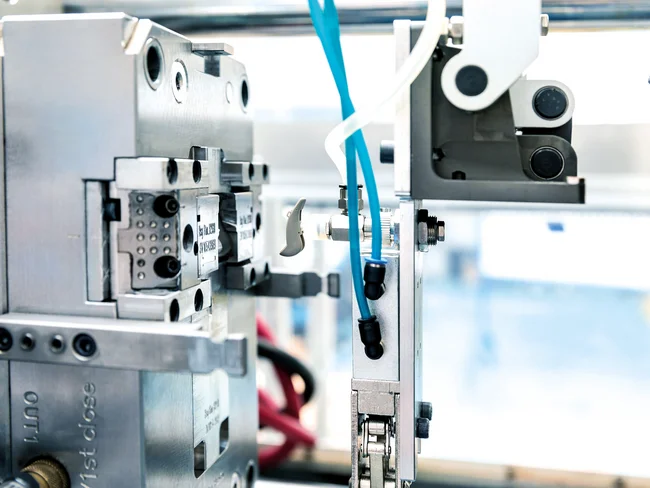 Plastic injection molding of a hearing aid component at the Cicor site in Batam