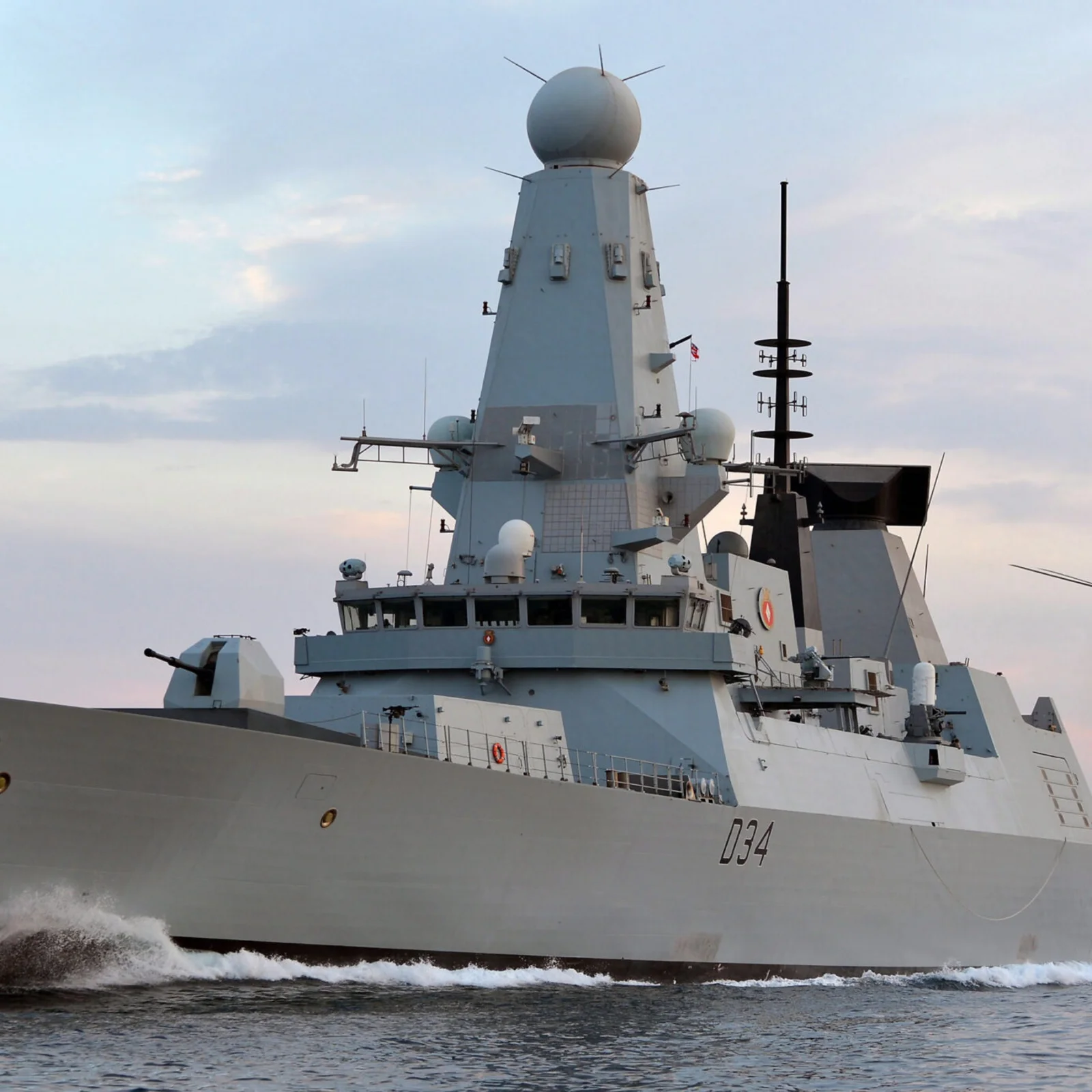 Modern naval frigate (Type 45) at sea with helicopter, representing Cicor maritime electronics systems.